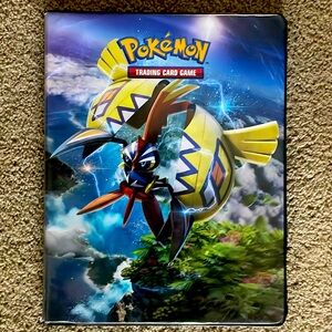 Pokémon book with 130+ cards